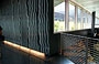 THE McCORMICK TRIBUNE CAMPUS CENTER. Particolari dei materiali contrastati dall'illuminazione a pavimento per scelta di Rem Koolhaas