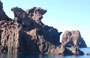 GOLFO DI PORTO. Lastre di porfido, basalto e riolite affiorano dal mare come mostri marini millenari