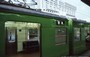 KYOTO. KYOTO JR STATION - un coloratissimo treno verde e sullo sfondo la Stazione
