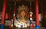 LADAKH. Tikse Gompa - la statua del Buddha nella sala della preghiera: doni e offerte al Buddha
