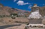 LADAKH. Likir Gompa - in primo piano uno stupa nel paesaggio e in lontananza il gompa di Likir