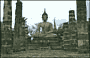SUKHOTHAI. Wat Mahathat - Buddha seduto che tocca la terra