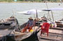 HOI AN. Barche ormeggiate sulle rive del Thu Bon River di fronte a D Bach Dang